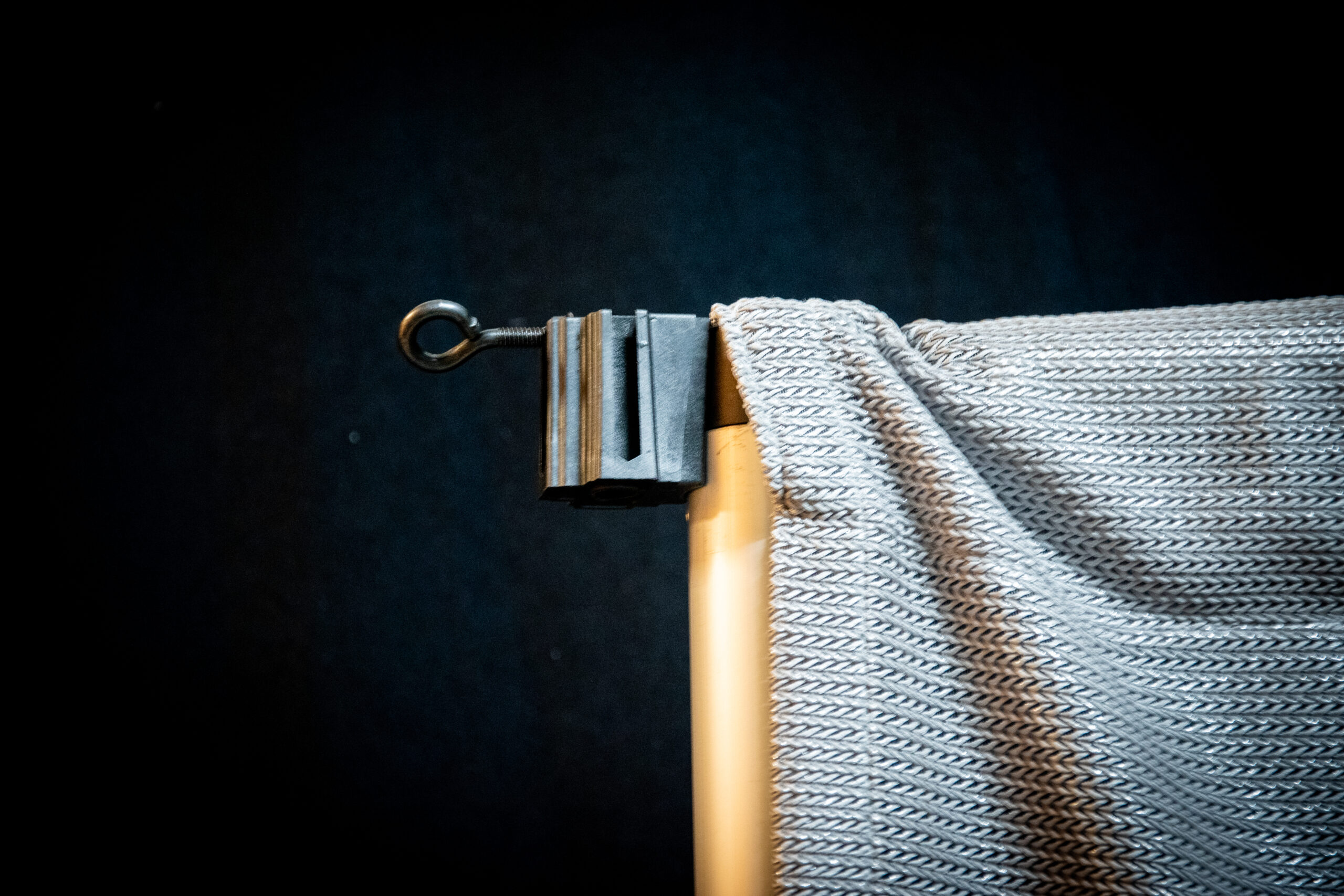 Shoulder Block mounted to Upright covered by silver curtain